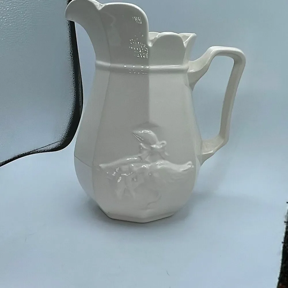 Vintage embossed ceramic country goose pitcher .